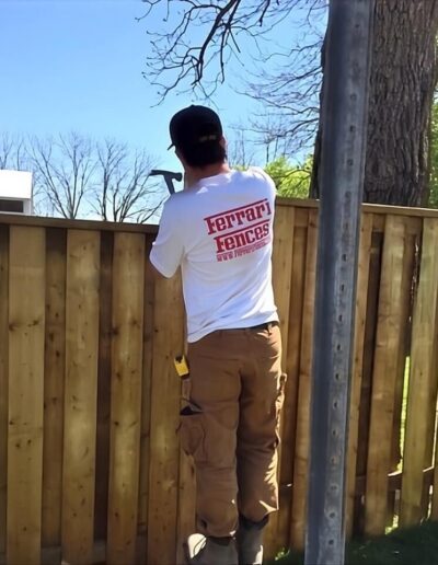 Ferrari Fences Worker Finishing Wooden Fence