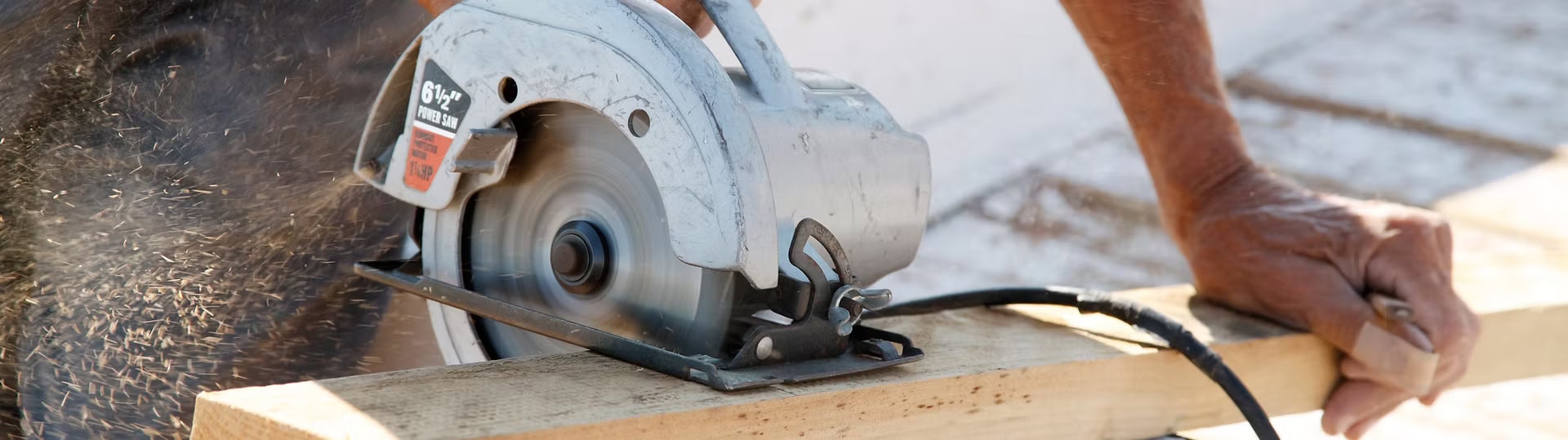 close up of circular saw cutting wood for a new fence